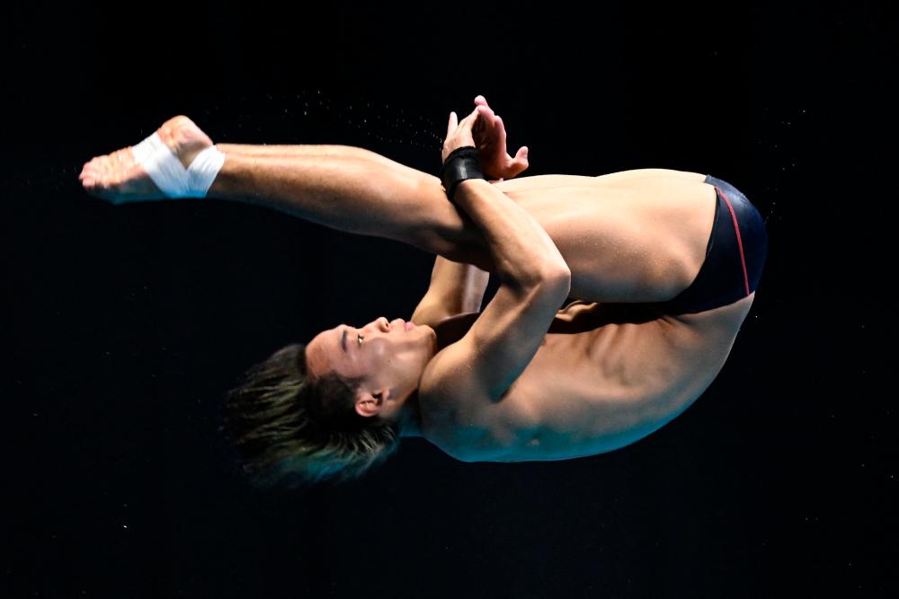 Bertrand Rhodict Anak Lises competes in the semi-final of the men’s 10m platform diving event during the World Aquatics Championships in Fukuoka on July 21, 2023/AFPPix