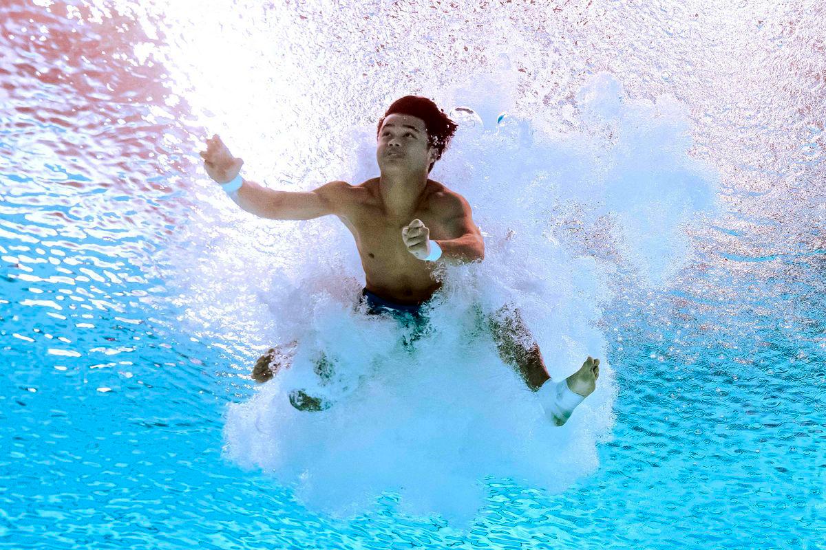 Malaysia's diver Elvis Priestly Anak Clement competes in the final of the men's 10m platform diving event during the 2025 World Aquatics Championships in Singapore on August 2, 2025. - AFPPIX