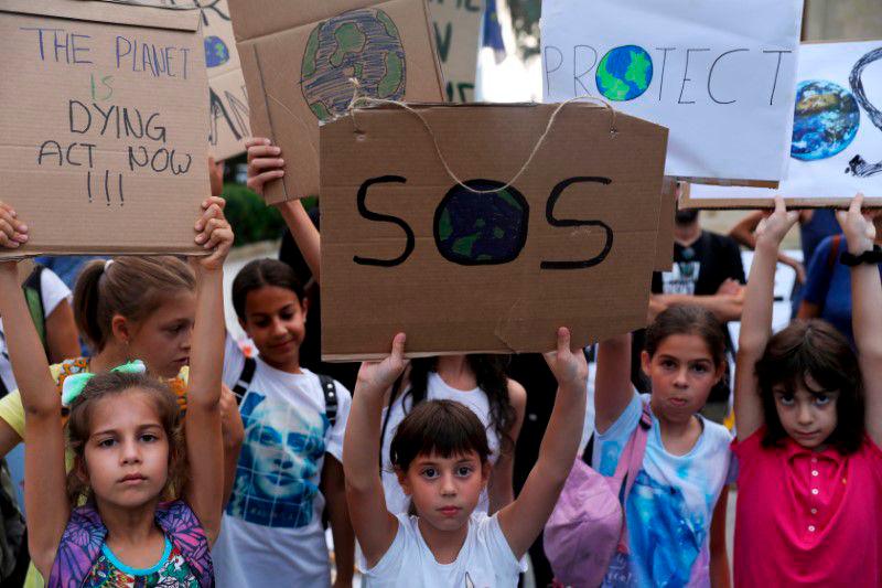 Children hold placards during a global climate change strike rally in Nicosia, Cyprus September 27, 2019. REUTERSpix
