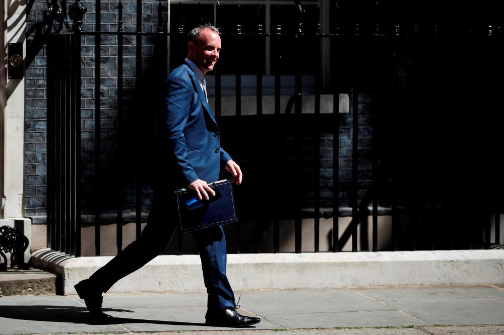 British Deputy Prime Minister and Secretary of State for Justice Dominic Raab leaves after attending a cabinet meeting at 10 Downing Street, in London, Britain, June 14, 2022. REUTERSpix