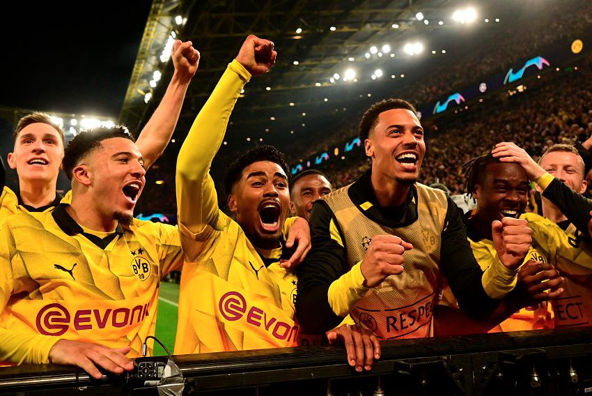 Dortmund’s players celebrate scoring their forth goal during the UEFA Champions League quarterfinal second leg match against Atletico Madrid. – AFPPIX