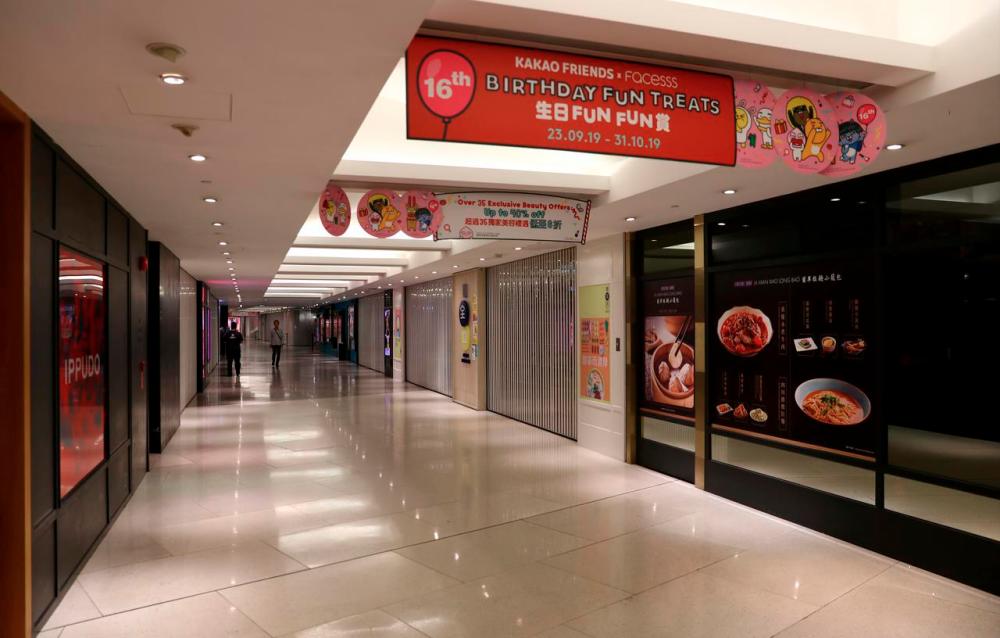 Closed stores are seen inside a shopping mall in Admiralty district, in Hong Kong, China