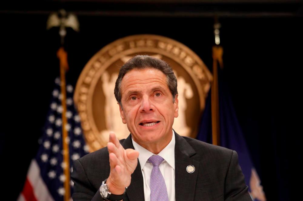 New York governor says ‘worst is over’ as virus toll tops 10,000
