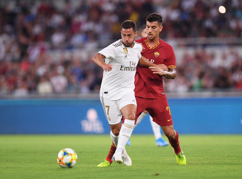 Filepix taken on Aug 11 shows Real Madrid’s Eden Hazard in action with AS Roma’s Lorenzo Pellegrini in Stadio Olimpico, Rome, Italy. — Reuters