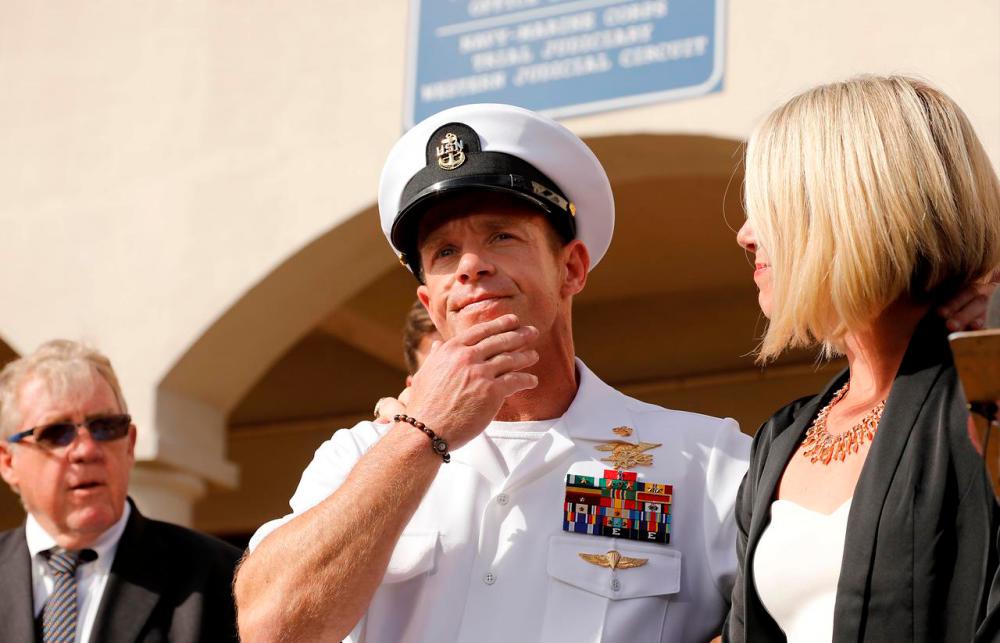 US Navy SEAL Special Operations Chief Edward Gallagher prepares to answer a question from the media with wife Andrea Gallagher after being acquitted on most of the serious charges against him during his court-martial trial at Naval Base San Diego in San Diego, California, US, July 2, 2019 — Reuters