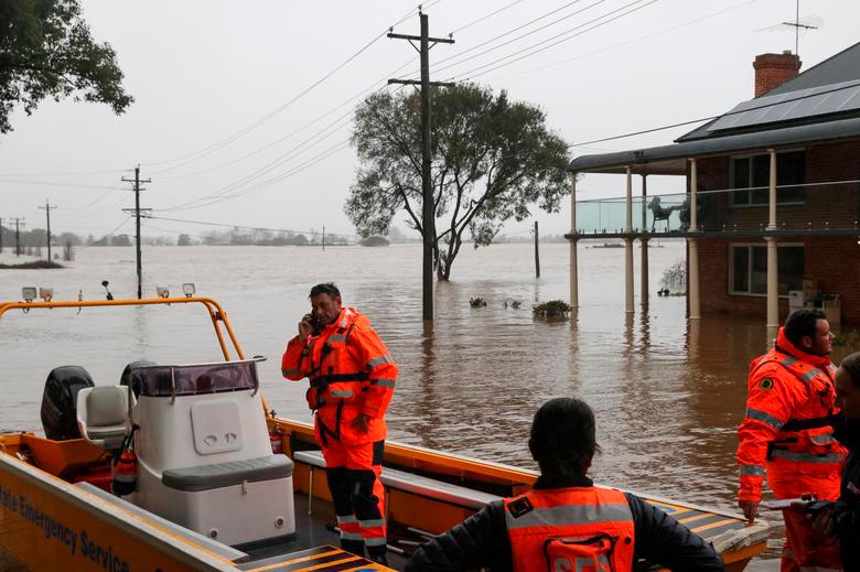 State Emergency Service (SES) personnel prepare to deploy as floodwaters submerge residential areas following heavy rains in the Windsor suburb of Sydney, Australia, July 5, 2022. REUTERSPIX