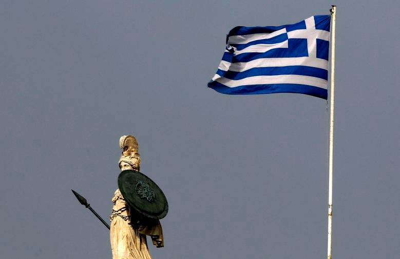 A Greek flag flutters next to a statue of ancient Goddess Athena in central Athens February 10, 2015. REUTERSPIX