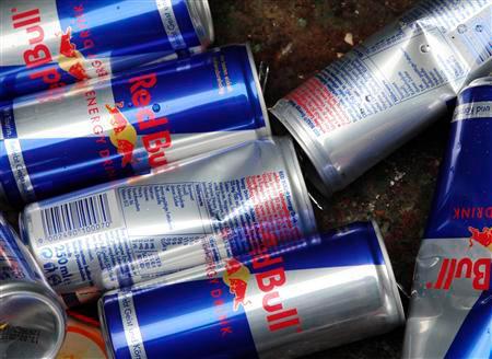 Red Bull drink cans are pictures inside a metal recycle container in Vienna March 15, 2013. REUTERSPIX