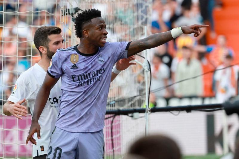 Real Madrid’s Brazilian forward Vinicius Junior reacts to being insulted pointing at the stands during the Spanish league football match between Valencia CF and Real Madrid CF at the Mestalla stadium in Valencia//AFPix