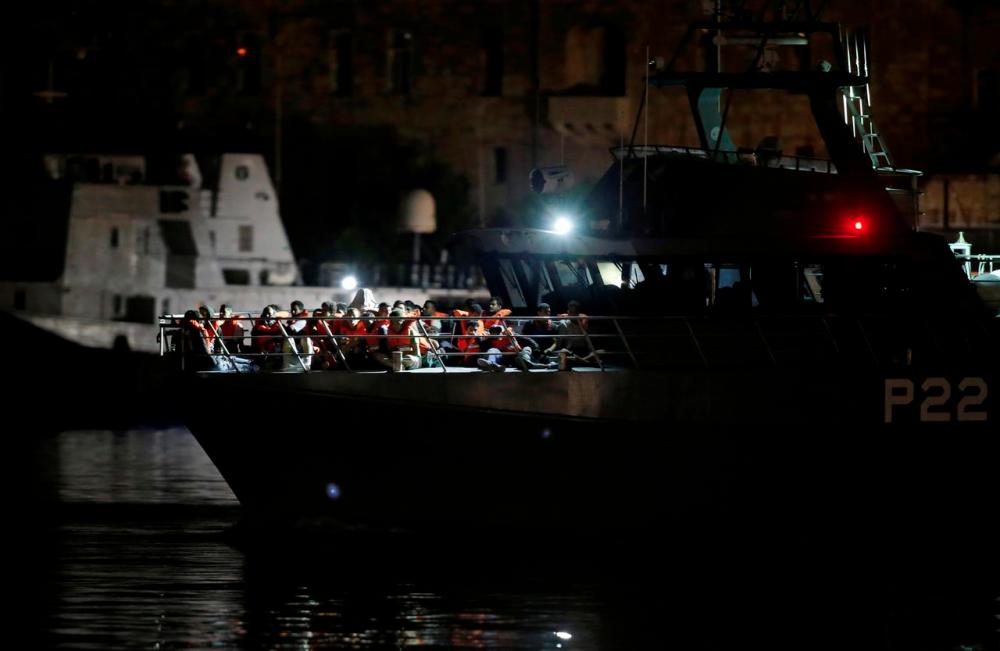 Migrants who were rescued by the Italian coastguard arrive on an Armed Forces of Malta patrol boat in Valletta’s Marsamxett Harbour, Malta September 17, 2019. — Reuters