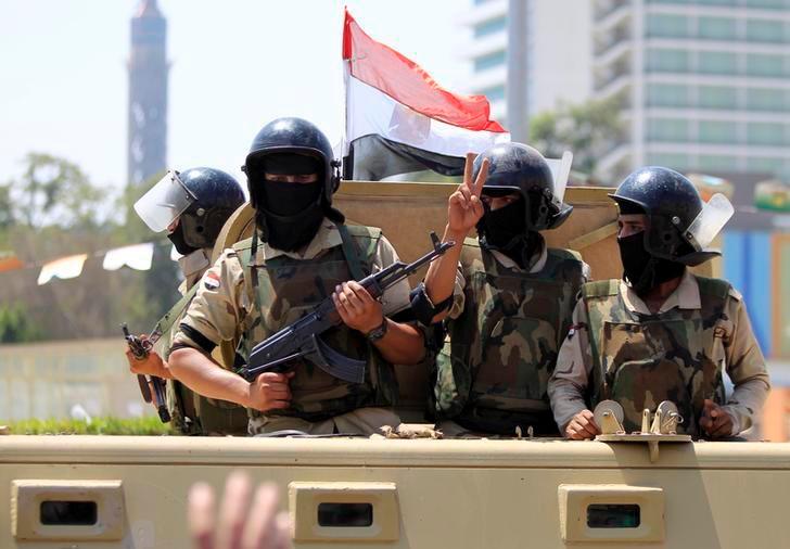Egyptian soldiers drive by Tahrir square in Cairo, August 6, 2015. REUTERSpix