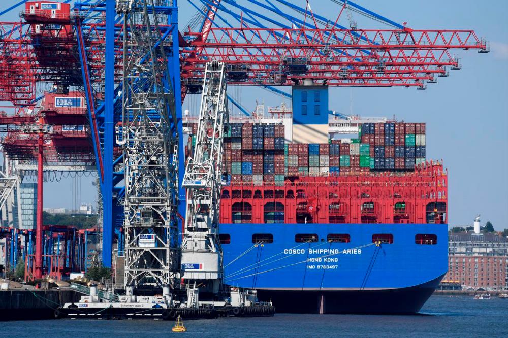Chinese container ship “Cosco Shipping Aries” is unloaded at a loading terminal in the port of Hamburg Germany. REUTERSPIX