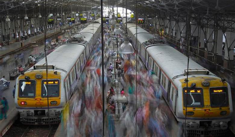 Commuters disembark from crowded suburban trains during the morning rush hour at Churchgate railway station on World Population Day in Mumbai July 11, 2012. REUTERSPIX