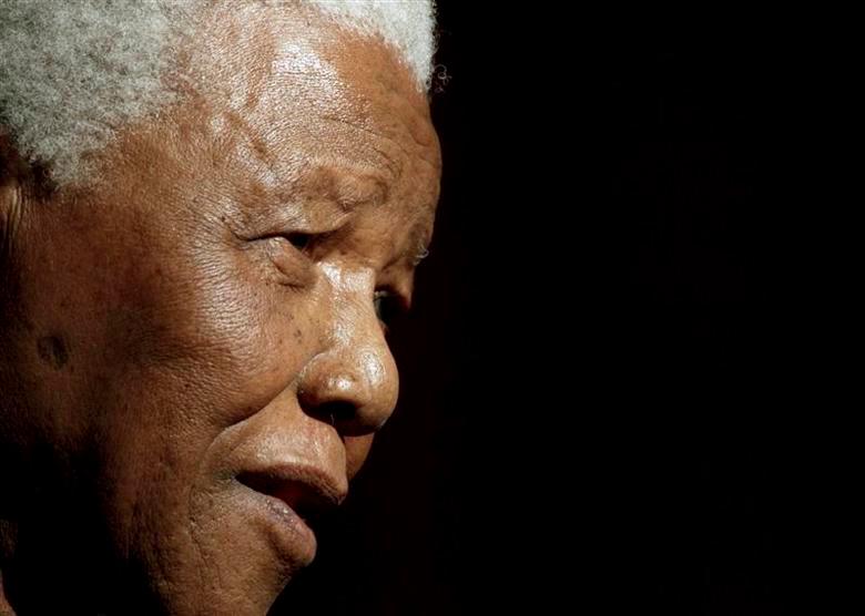 Former South African President Nelson Mandela speaks after being conferred with an Honorary Doctorate of Laws at the University of Galway in this June 20, 2003 file photo. REUTERSPIX