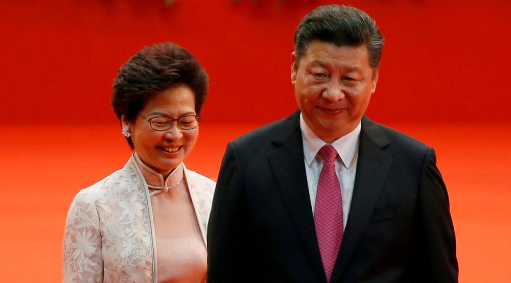 Filepix showing Hong Kong Chief Executive Carrie Lam (L) and Chinese President Xi Jinping walk after Lam took her oath, during the 20th anniversary of the city’s handover from British to Chinese rule, in Hong Kong — Reuters