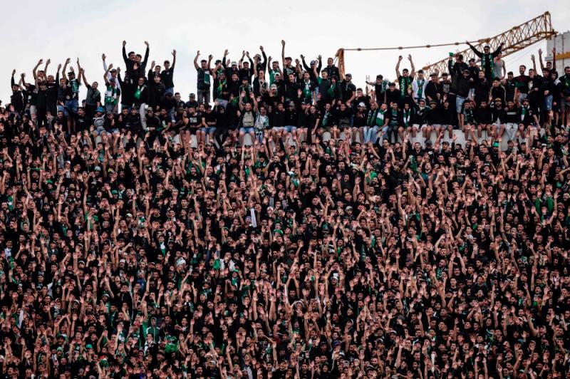 Supporters cheer during the CAF Champions League quarter-final football match between Morocco’s Raja Casablanca and Egypt’s Al Ahly at Mohammed V Stadium in Casablanca//AFPix