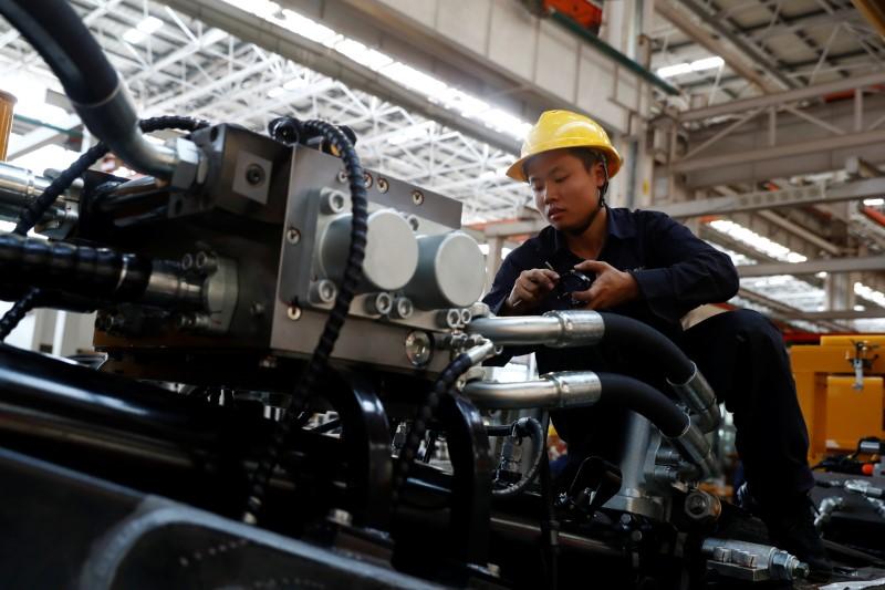 An employee works at a manufacturing plant of Sany Heavy Industry Co. during a government-organised tour of manufacturers based in Changsha, Hunan province, China. REUTERSPIX