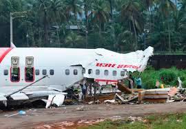 Officials inspect the site where a passenger plane crashed when it overshot the runway at the Calicut International Airport in Karipur, in Kerala, India, August 8, 2020. -Reuters