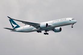 A Cathay Pacific Airways Airbus A350-900 airplane approaches to land at Changi International Airport in Singapore June 10, 2018. -Reuters