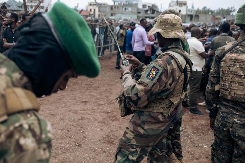 M23 soldiers are seen at the Stade de l'Unite' (Unity Stadium in French) in Goma on February 6, 2025 for a public gathering called by the armed group. Rwandan-backed M23 said Thursday it wanted to liberate all of the Congo in its first public meeting since seizing the eastern city of Goma after deadly clashes, as its fighters advanced towards another regional capital. After capturing Goma, the main city in North Kivu province, last week, the M23 and Rwandan troops launched a new offensive on Wednesday in a neighbouring province. - Alexis Huguet / AFP