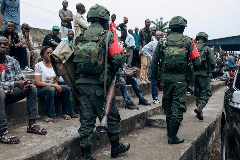 M23 soldiers are seen at the Stade de l'Unite' (Unity Stadium in French) in Goma on February 6, 2025 for a public gathering called by the armed group. Rwandan-backed M23 said Thursday it wanted to liberate all of the Congo in its first public meeting since seizing the eastern city of Goma after deadly clashes, as its fighters advanced towards another regional capital. After capturing Goma, the main city in North Kivu province, last week, the M23 and Rwandan troops launched a new offensive on Wednesday in a neighbouring province. - Alexis Huguet / AFP