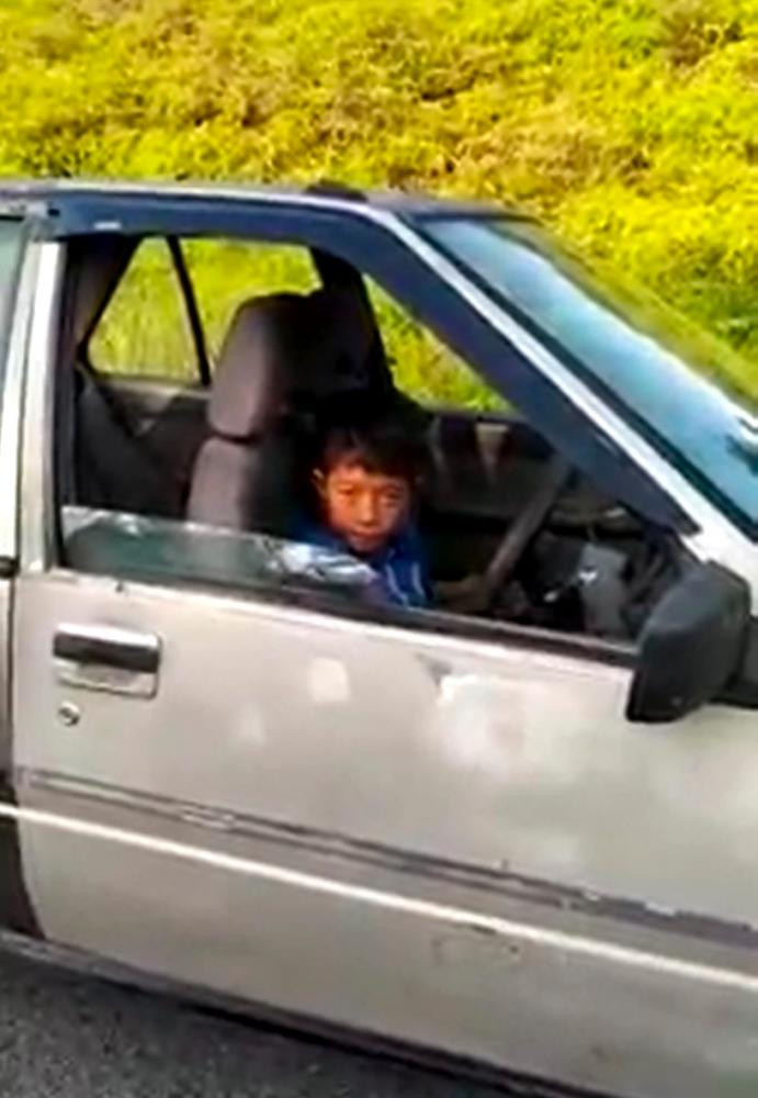 Nine-year-old caught on camera for driving a car alone
