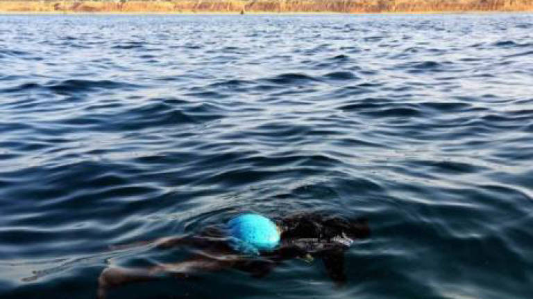 Man drowns after saving teen son