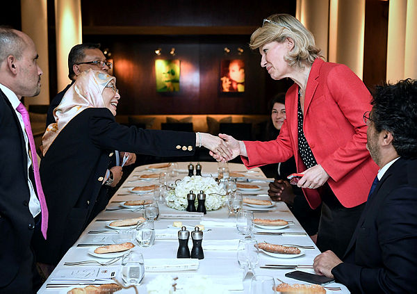 Deputy Prime Minister Dr Wan Azizah (L) shaking hands with French parliament member Anne Genetet. — Bernama