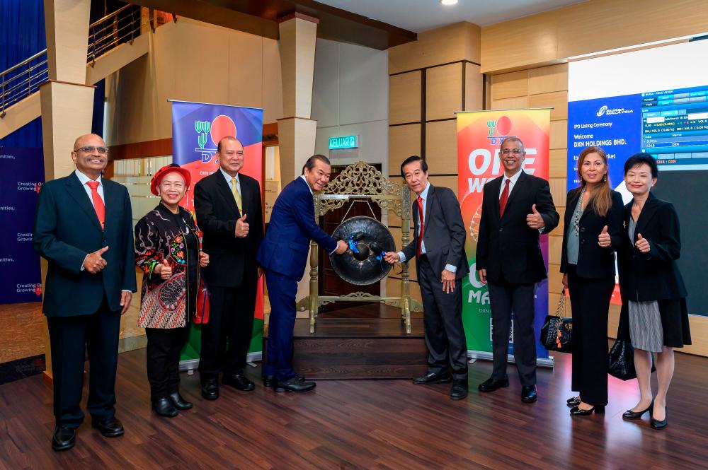 From left: DXN director Abraham Verghese TV Abraham, director Datuk Noripah Kamso, director Datuk Lim Boon Yee, Lim, director and CEO Teoh Hang Ching, director Vibhav Panandiker, director Tunku Afwida Tunku A Malek and director Ong Huey Min at the listing ceremony.