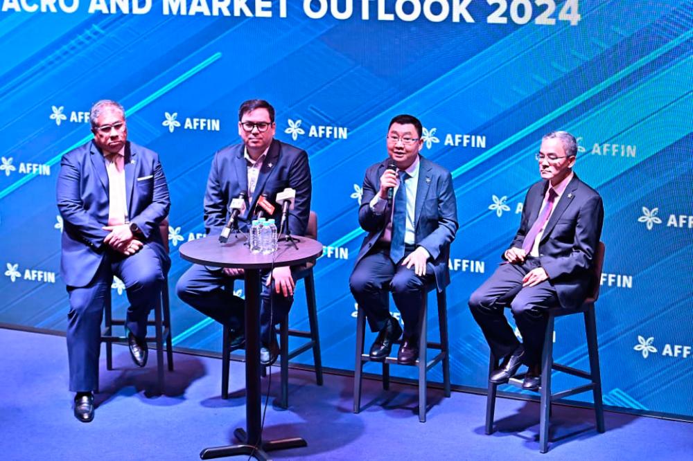 From left: Affin Hwang Investment Bank CEO Nurjesmi Mohd Nashir, Affin Bank president and group CEO Datuk Wan Razly Abdullah, Tan and Affin Hwang Investment Bankhead of research Loong Chee Wei during a question-and-answer session.
