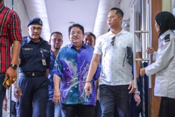 Tengku Adnan pleads not guilty to two counts of receiving RM3m bribe. — Sunpix by Adib Rawi Yahya