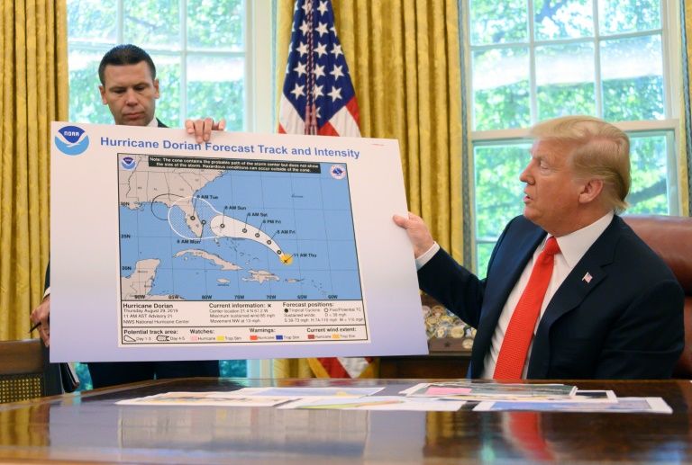 US President Donald Trump updates the media on Hurricane Dorian preparedness from the Oval Office at the White House. — AFP