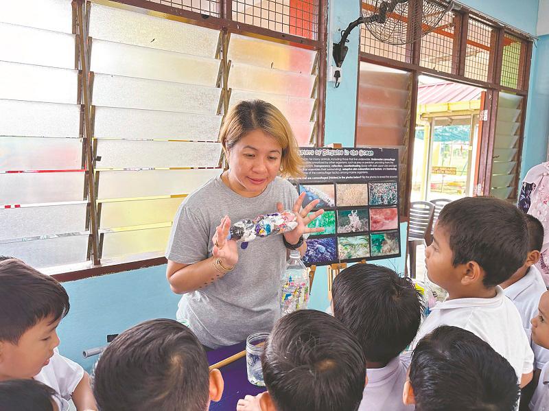 $!Louisa (standing) feels awareness begins in the classroom, to introduce the environment and how important its components are, especially marine life.