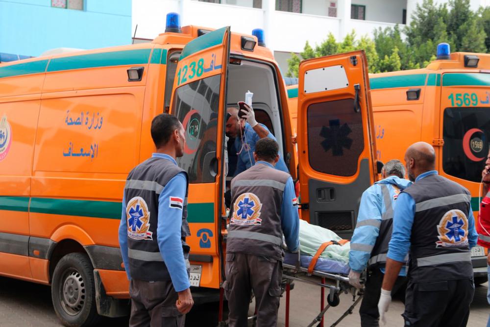 A handout picture released by the Suez Governorate Media Office on December 28, 2019 shows paramedics transporting one of the victims who were injured in a bus cash on the road to the Ain Sokhna resort east of the Egyptian capital Cairo , upon arrival at Suez General Hospital. - AFP