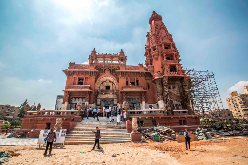 This picture taken on August 18, 2019 shows restoration works ongoing at the historic “Le Palais Hindou” (also known as the “Baron Empain Palace”) built by in the early 20th century by Belgian industrialist Edouard Louis Joseph, Baron Empain, in the classical Khmer architectural style of Cambodia’s Angkor Wat, in the Egyptian capital Cairo’s northeastern Heliopolis district. — AFP