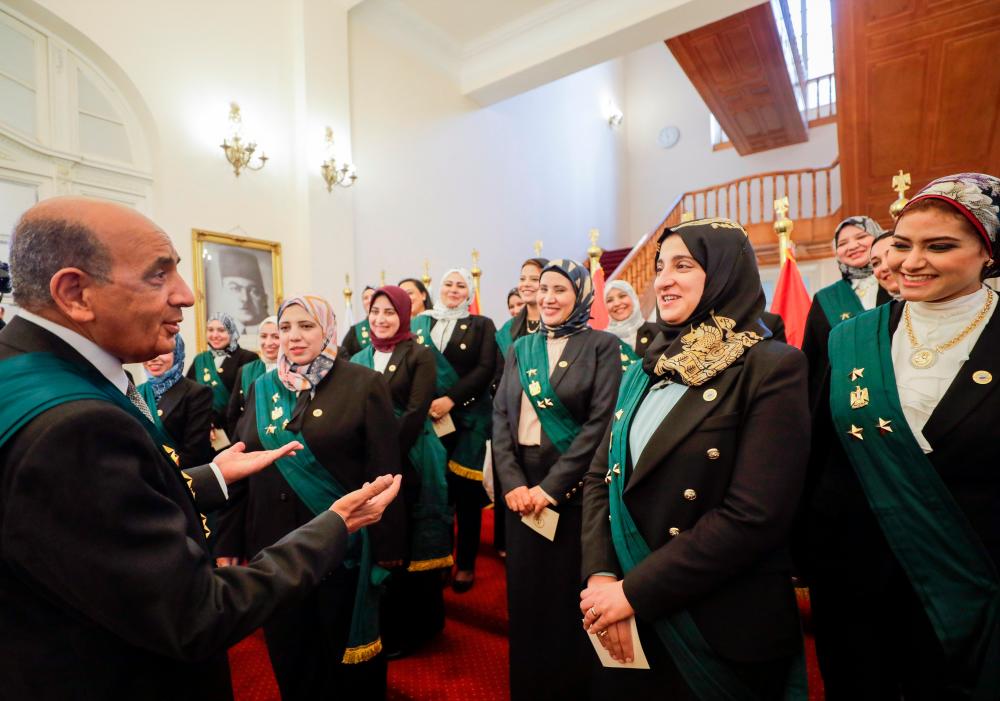 Mohamed Mahmoud Farag Hossam al-Din, Head of the Council of State, speaks with newly appointed female judges of the State Lawsuits Authority after the swearing-in ceremony at the State Council headquarters in Giza, Egypt October 19, 2021. REUTERSpix