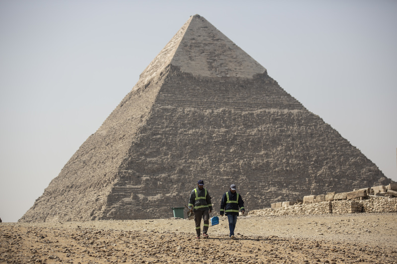 Workers clean and disinfect areas near Egypt’s pyramids, emptied of tourists during the pandemic. Egypt’s Ministry of Tourism and Antiquities has launched a series of virtual and guided video tours of museums and archaeological sites around the country.