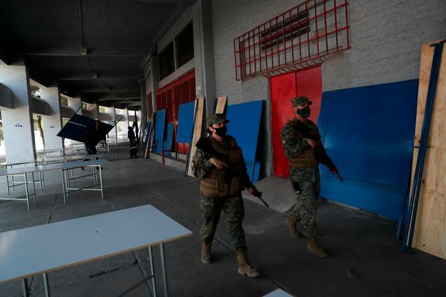 Soldiers patrol inside a polling station ahead of the upcoming referendum on a new Chilean constitution in Santiago, Chile, October 23, 2020. — Reuters