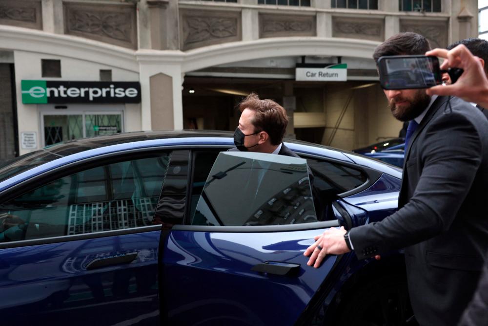 Tesla CEO Elon Musk gets into a car as he leaves the Phillip Burton Federal Building on February 03, 2023 in San Francisco, California. AFPPIX
