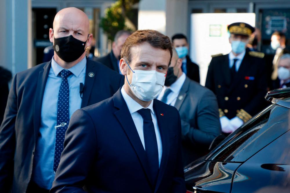 France's President Emmanuel Macron looks on as he leaves the 58th International Agriculture Fair (Salon de l'Agriculture) at the Porte de Versailles exhibition centre in Paris, on February 26, 2022. AFPpix