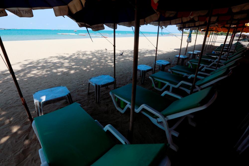 Empty chairs are seen on a beach, which is usually full of tourists, amid fears of coronavirus disease (Covid-19) in Pattaya, Thailand, March 27, 2020. - Reuters