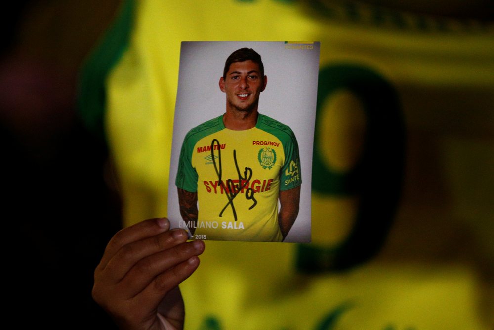 A fan holds a portrait of Emiliano Sala in Nantes after news that newly-signed Cardiff City player Emiliano Sala was missing in a light aircraft that disappeared the previous evening of Jan 22, 2019. — Reuters