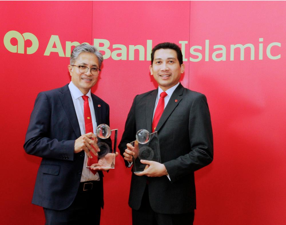 Sulaiman (left) and Eqhwan with the Most Promising Islamic Bank Malaysia Award 2019 and the Best Islamic Banking CEO Malaysia Award 2019 awarded by GBAF.