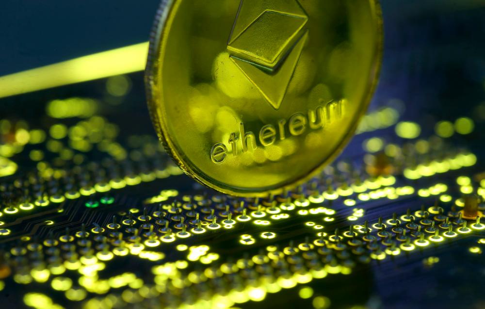 Representation of ethereum standing on a PC motherboard is seen in this illustration picture. – REUTERSPIX