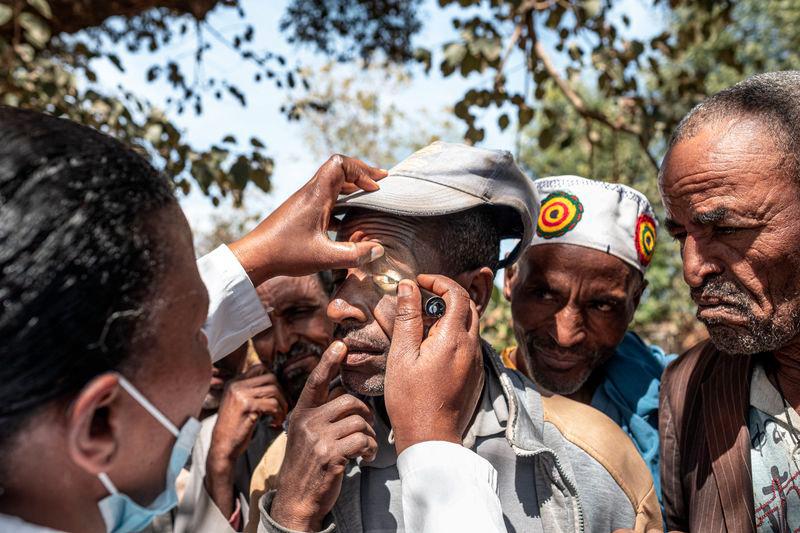 Members of the community undergo check-ups to determine if they are affected by trachoma in a village near Butajira, on January 16, 2025. - AFPPIX