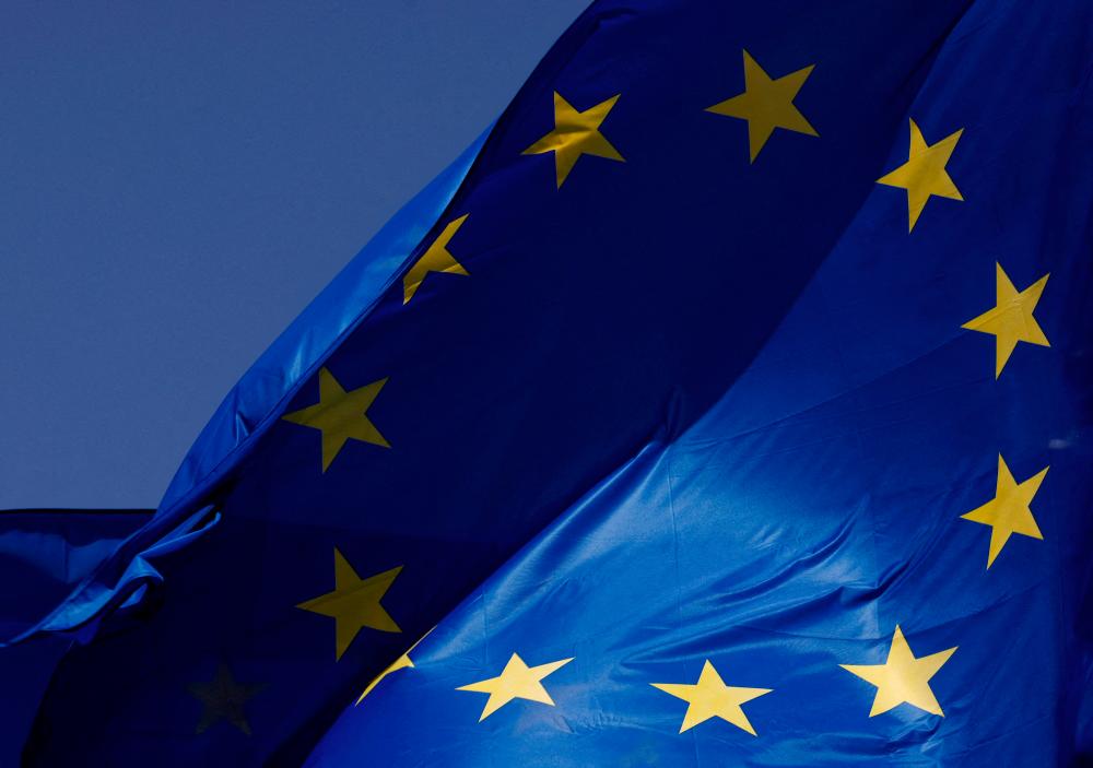 FILE PHOTO: European Union flags flutter outside the EU Commission headquarters in Brussels, Belgium June 17, 2022. - REUTERSPIX