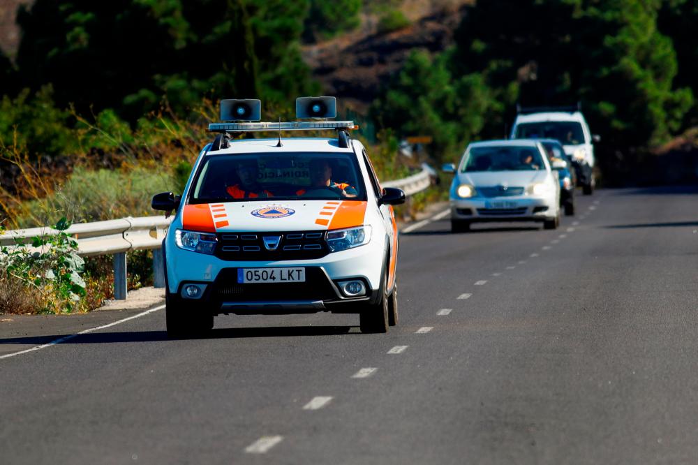 A vehicle with loudspeakers to warn neighbours of an emergency is photographed in El Paso, on the Canary Island of La Palma, Spain, September 19, 2021. REUTERSpix