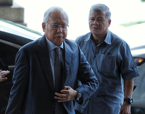 Former Prime Minister Datuk Seri Najib Abdul Razak arrives at the Kuala Lumpur High Court Complex to attend a mention of the case in relation to three counts of CBT and misuse of power involving a RM42 million fund owned by SRC International Sdn Bhd. — BBXpress