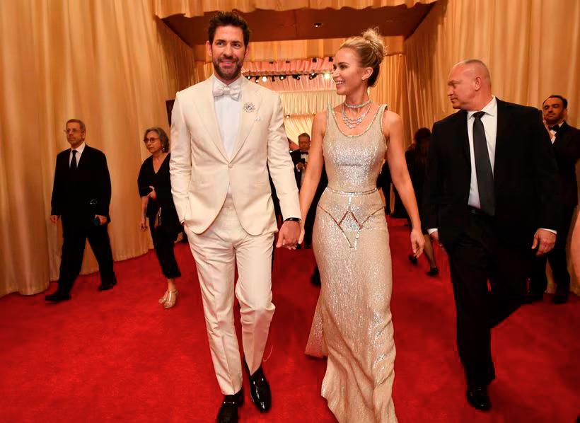 $!Emily Blunt and her husband, John Krasinski, wore matching cream outfits. MACON/AFP