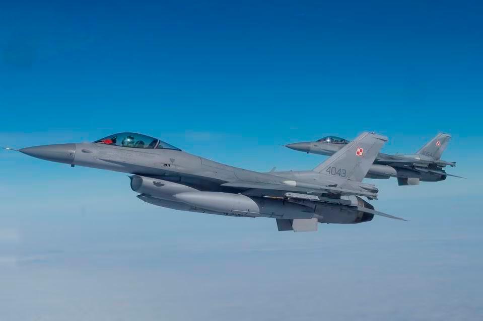 F-16 aircrafts fly during a NATO media event at an airbase in Malbork, Poland, March 21, 2023. REUTERSPIX